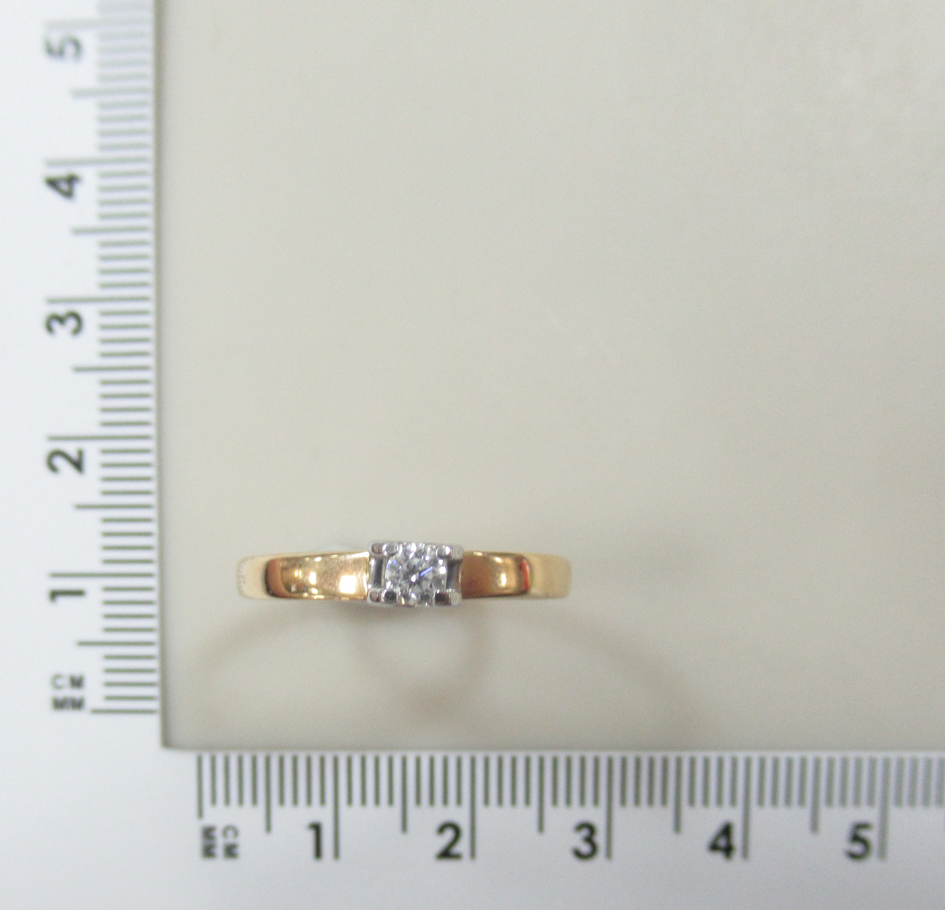 Золотое кольцо 585 пробы; родий; вставки 1 Бр.Кр-57 0,107 3/6А